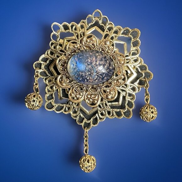 Vintage Filigree Brooch with Blue Glass Cabochon and Dangling Charms